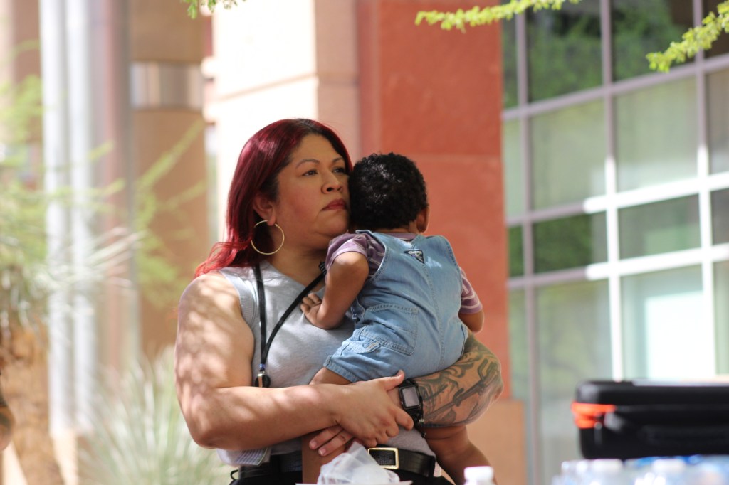 anna hernandez holds a baby