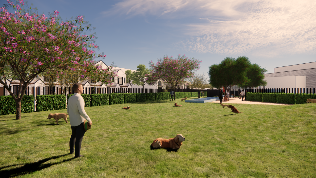 A man with a dog in an outdoor park,