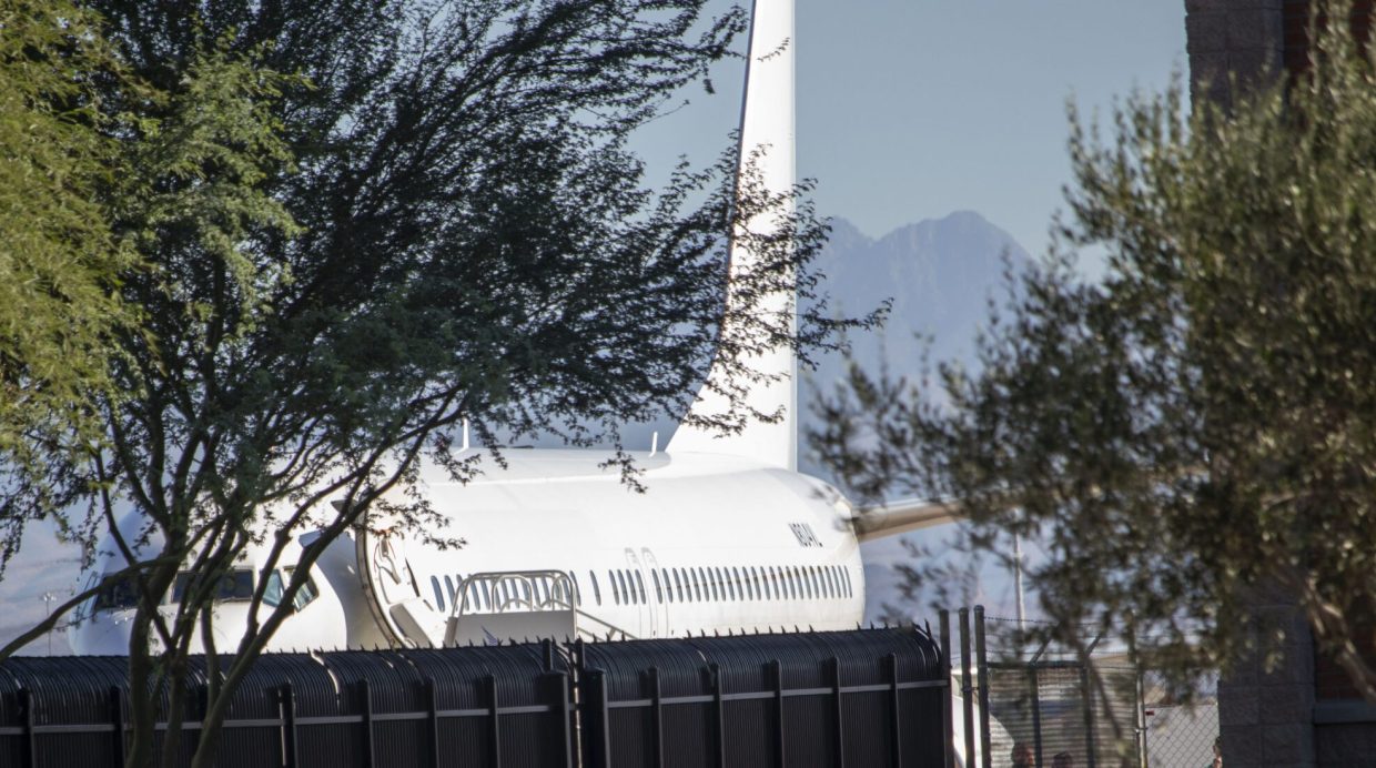 An Avelo Airlines jet that has been painted all white and is used by Immigration and Customs Enforcement’s Air Operations at Mesa Gateway Airport for deportation and detainee transfers.
