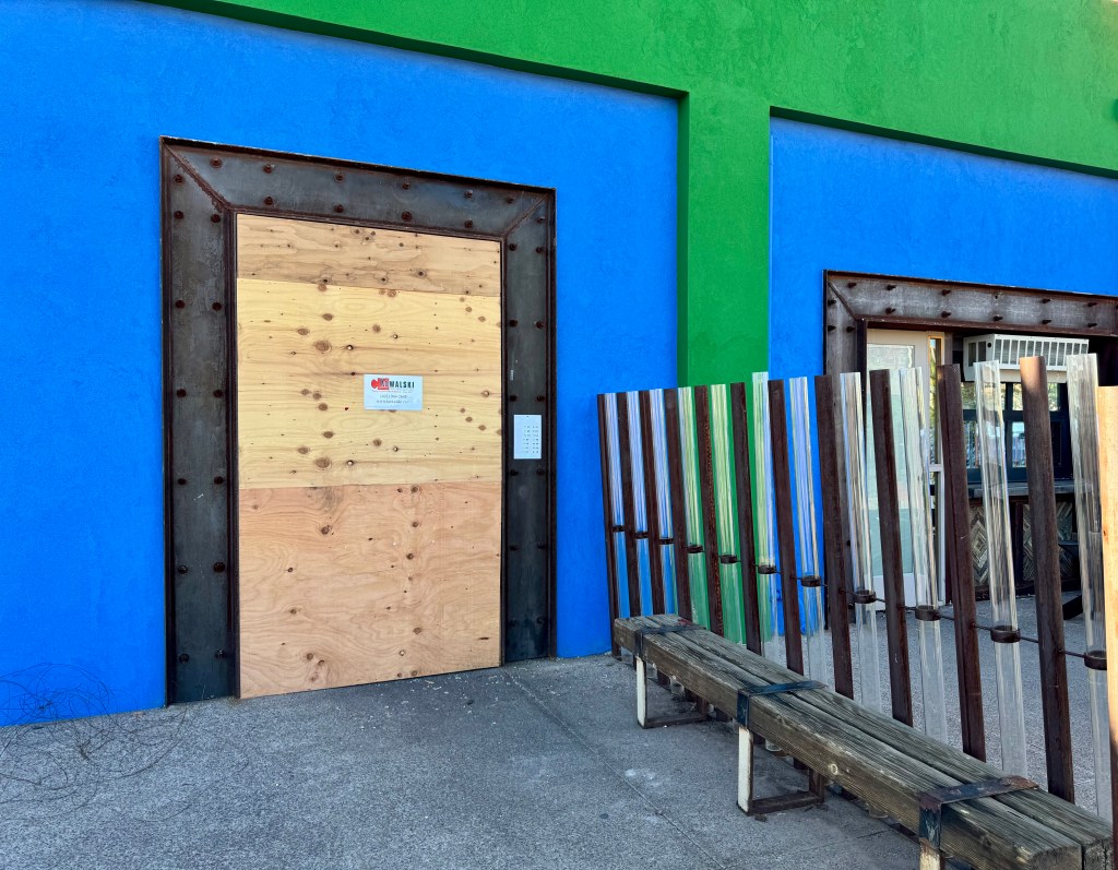 La Santisima door boarded up.