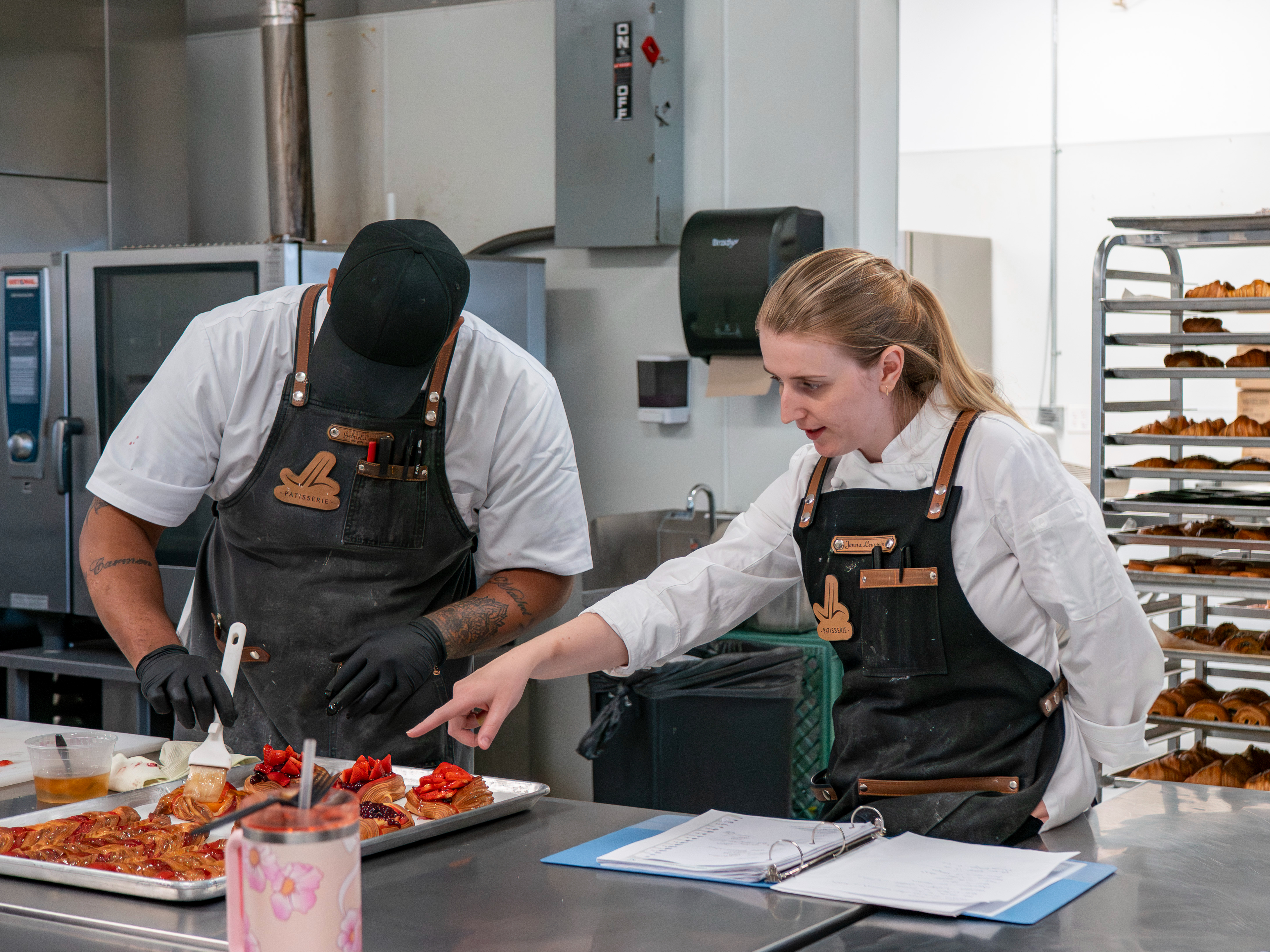 People finishing pastries in a bakery