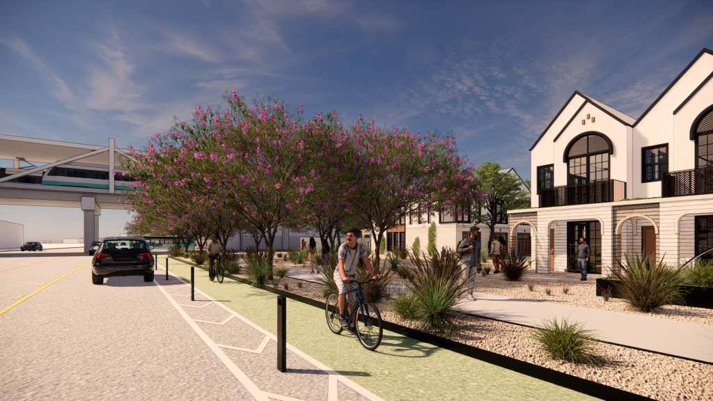 A beige two-story apartment house along a street.