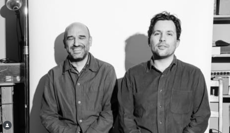 2 band members in Pedro the Lion pose for black and white photograph