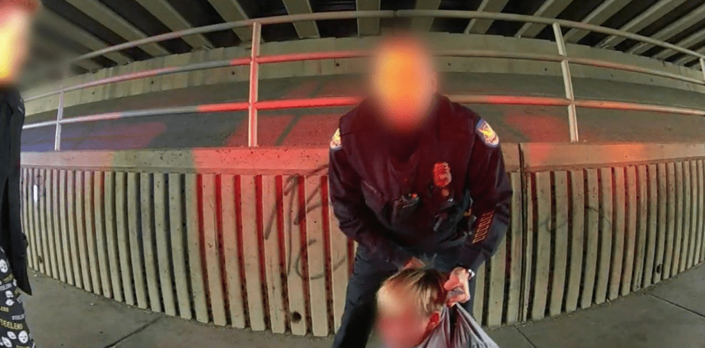 footage of a phoenix police officer picking up a 13-year-old boy by the fabric of his hoodie
