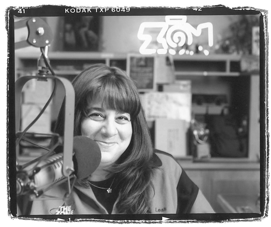 A woman in a radio studio.