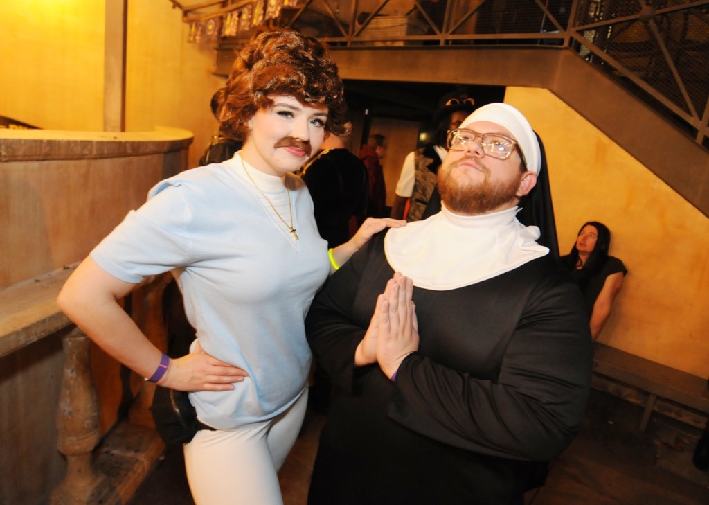 A man and woman dressed as characters from Nacho Libre.