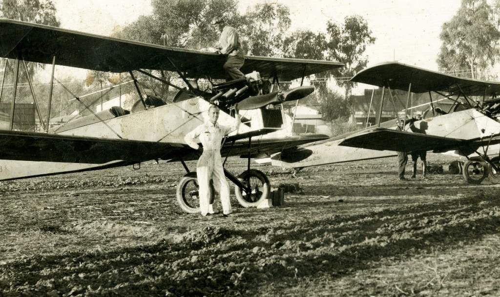 Pilots next to planes