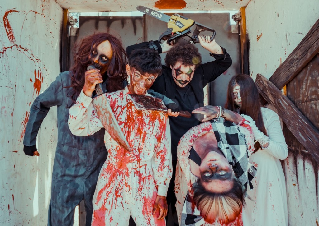 Haunted house characters in costume.