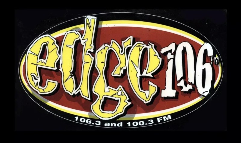 A radio station sticker with text.