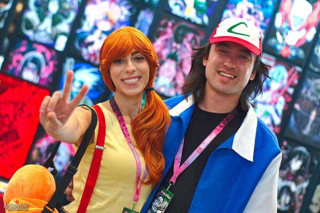 A male and female cosplayer dressed as Pokemon characters.