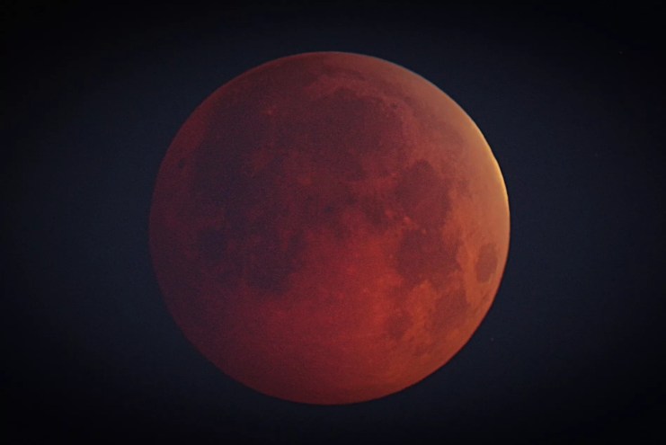 A full moon during a lunar eclipse.