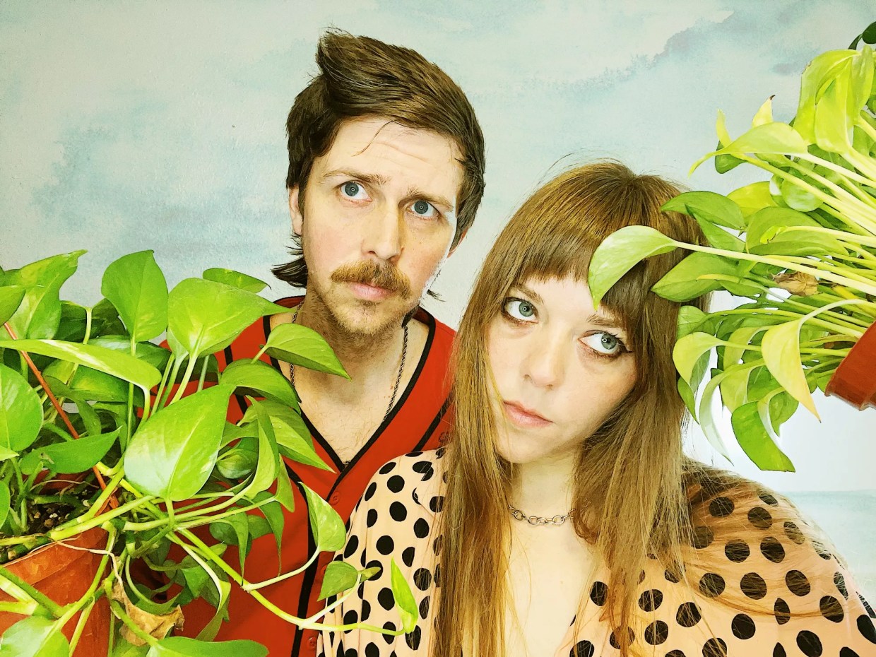 A man and a woman in a band.