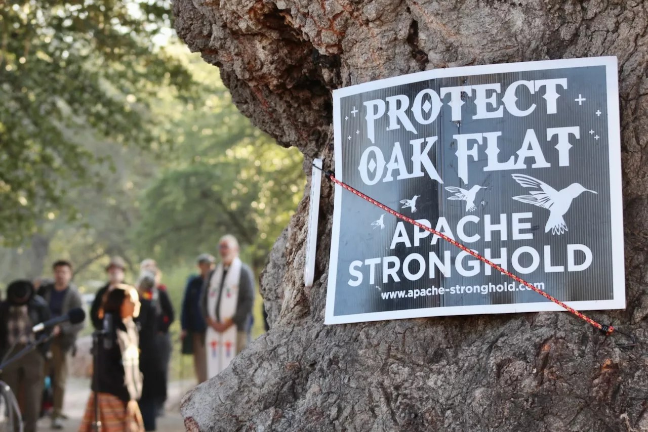 a sign that says "protect oak flat"