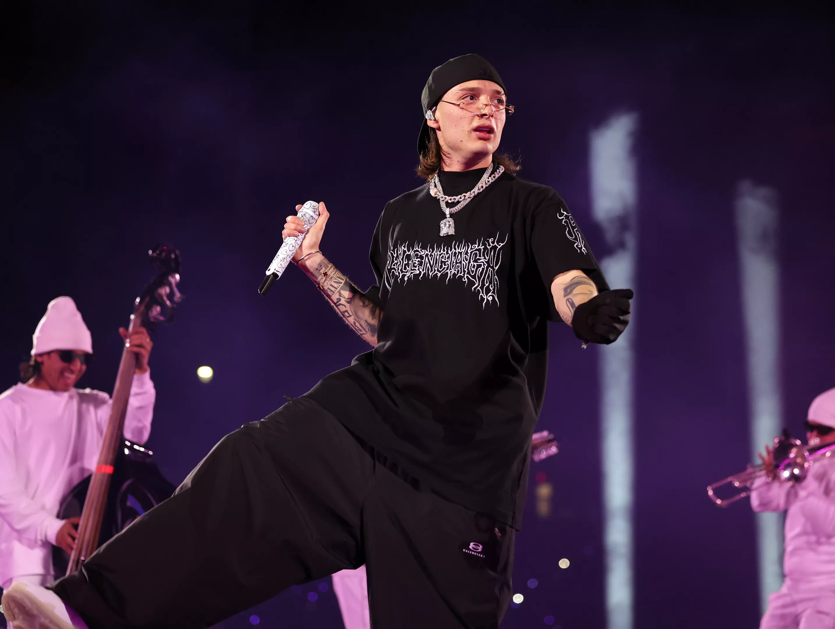 A man singing onstage.