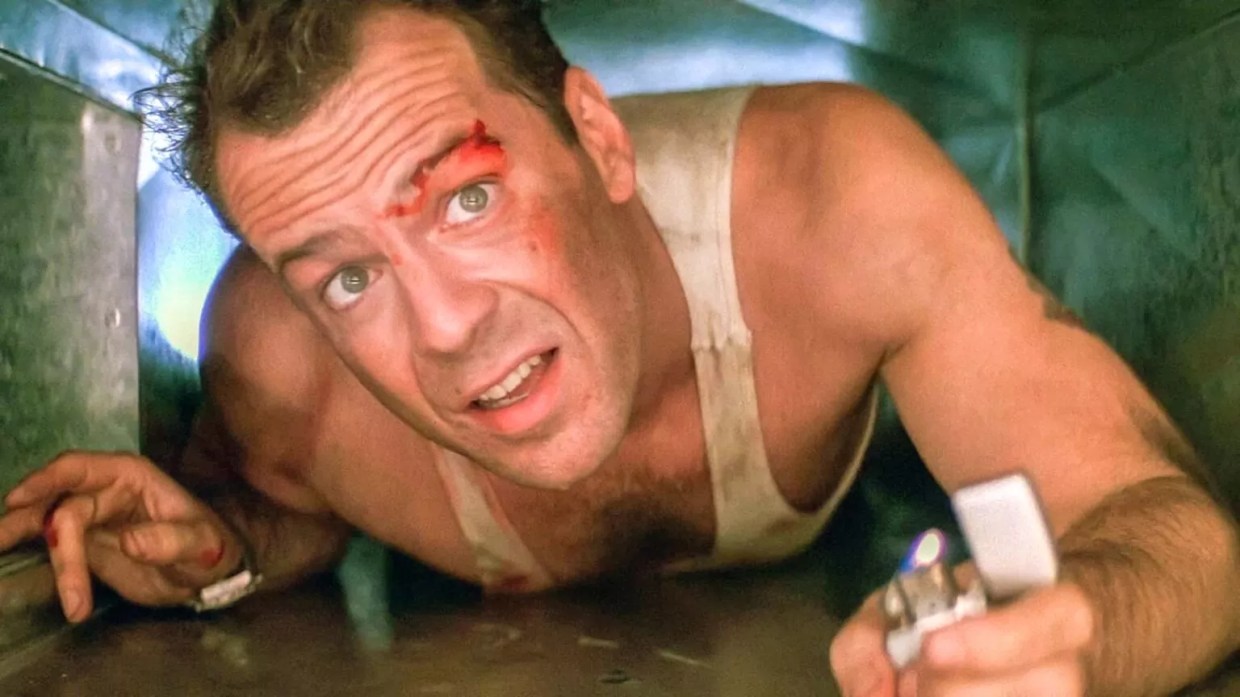 Bruce Willis in an air vent.