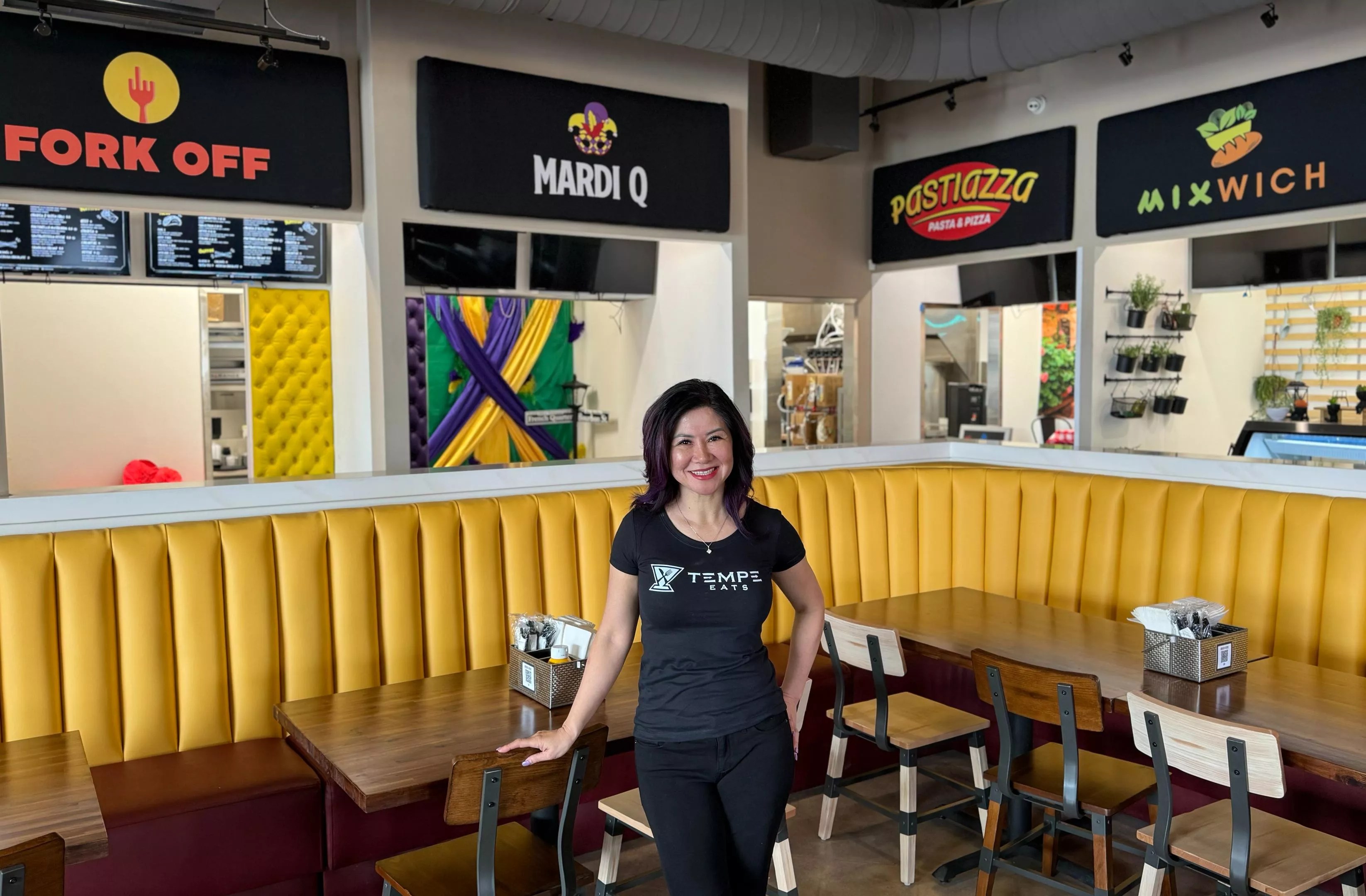 Teresa Nguyen stands in a food hall.