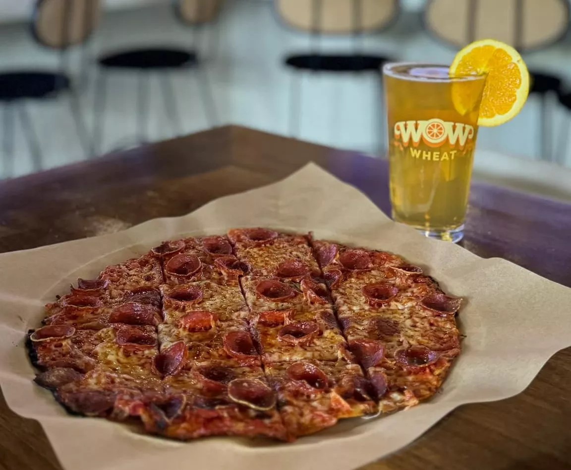 A personal pizza and pint of beer.
