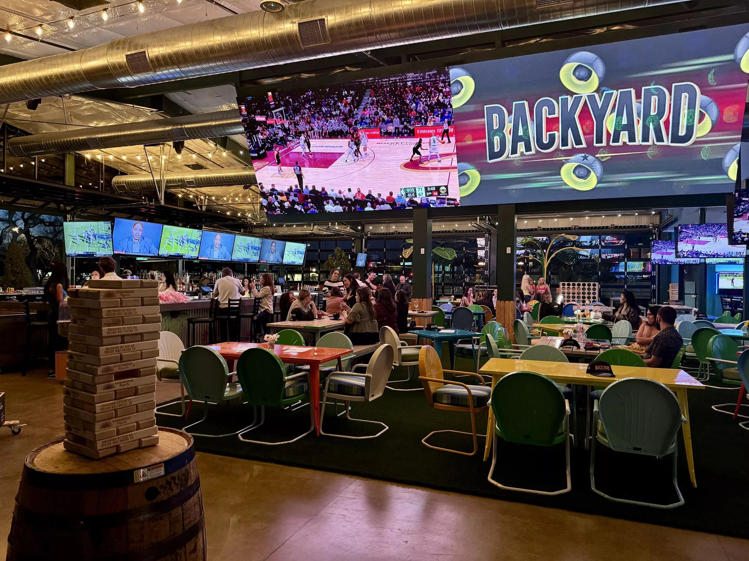 Tables and TVs at Backyard.