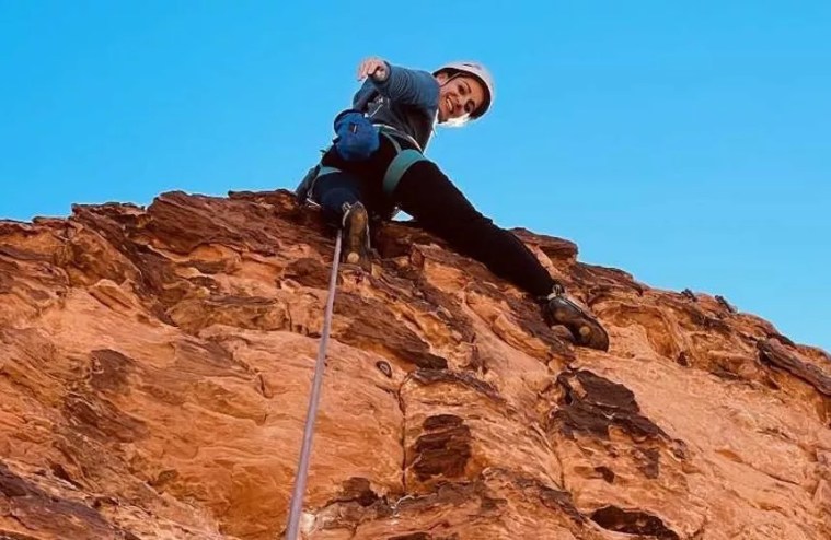 A woman rock-climbing.