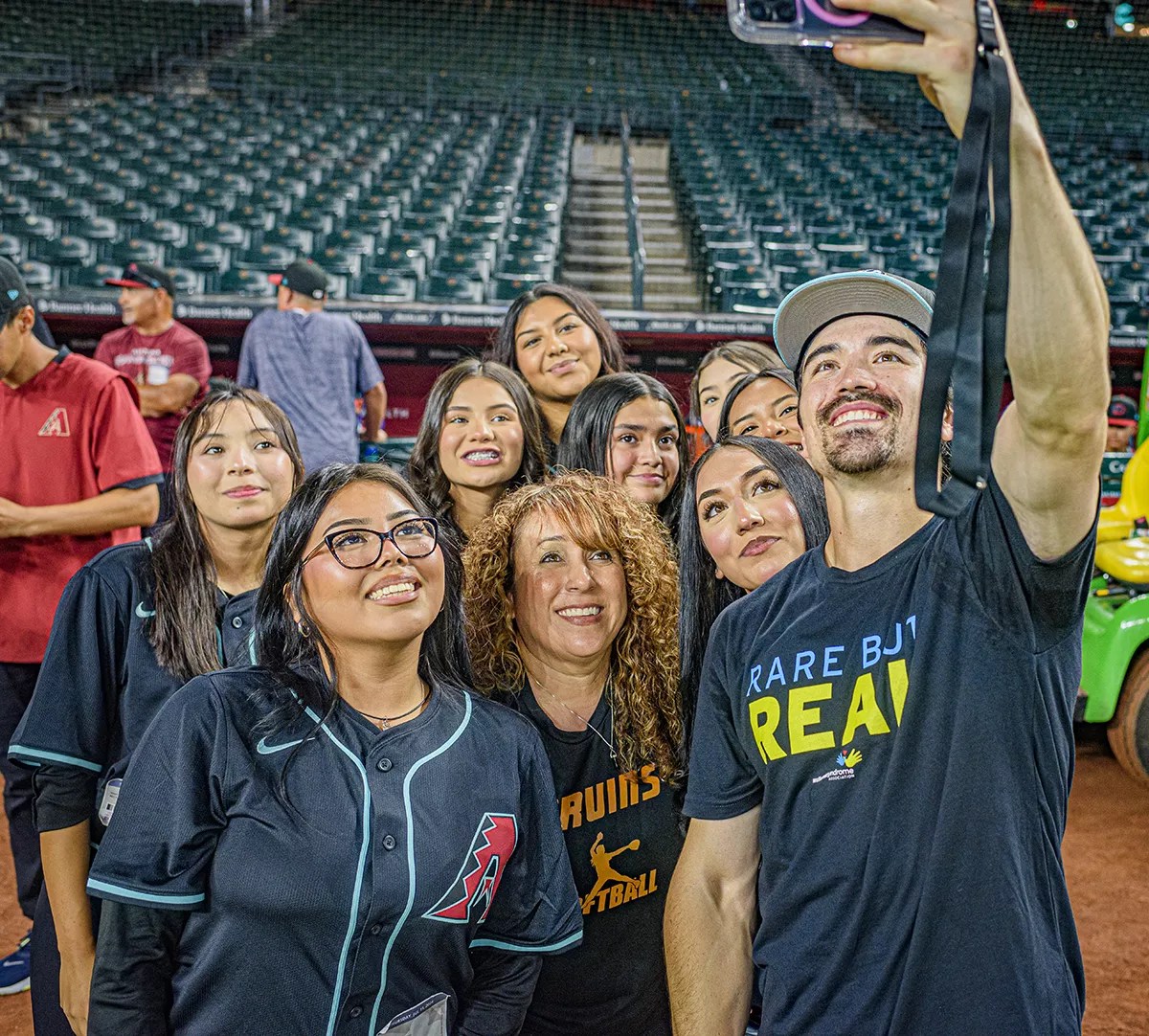 Corbin Carroll takes a selfie with fans