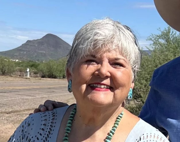 An older woman with white hair.