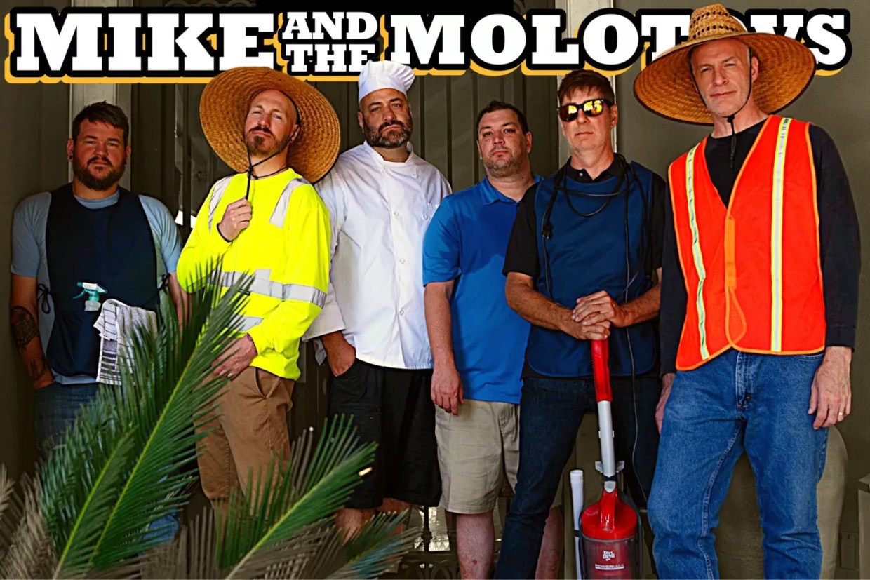 A group of men in the uniforms of workers.