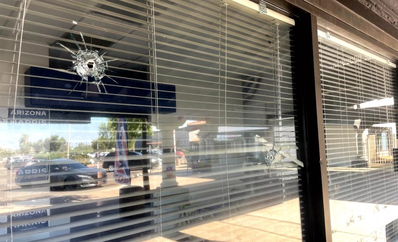 bullet holes in a window