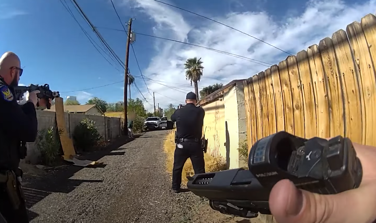 body cam footage of police officers pointing their guns at someone