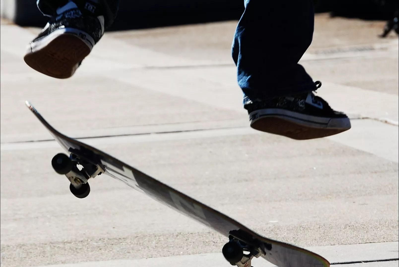 A person on a skateboard in mid-air.