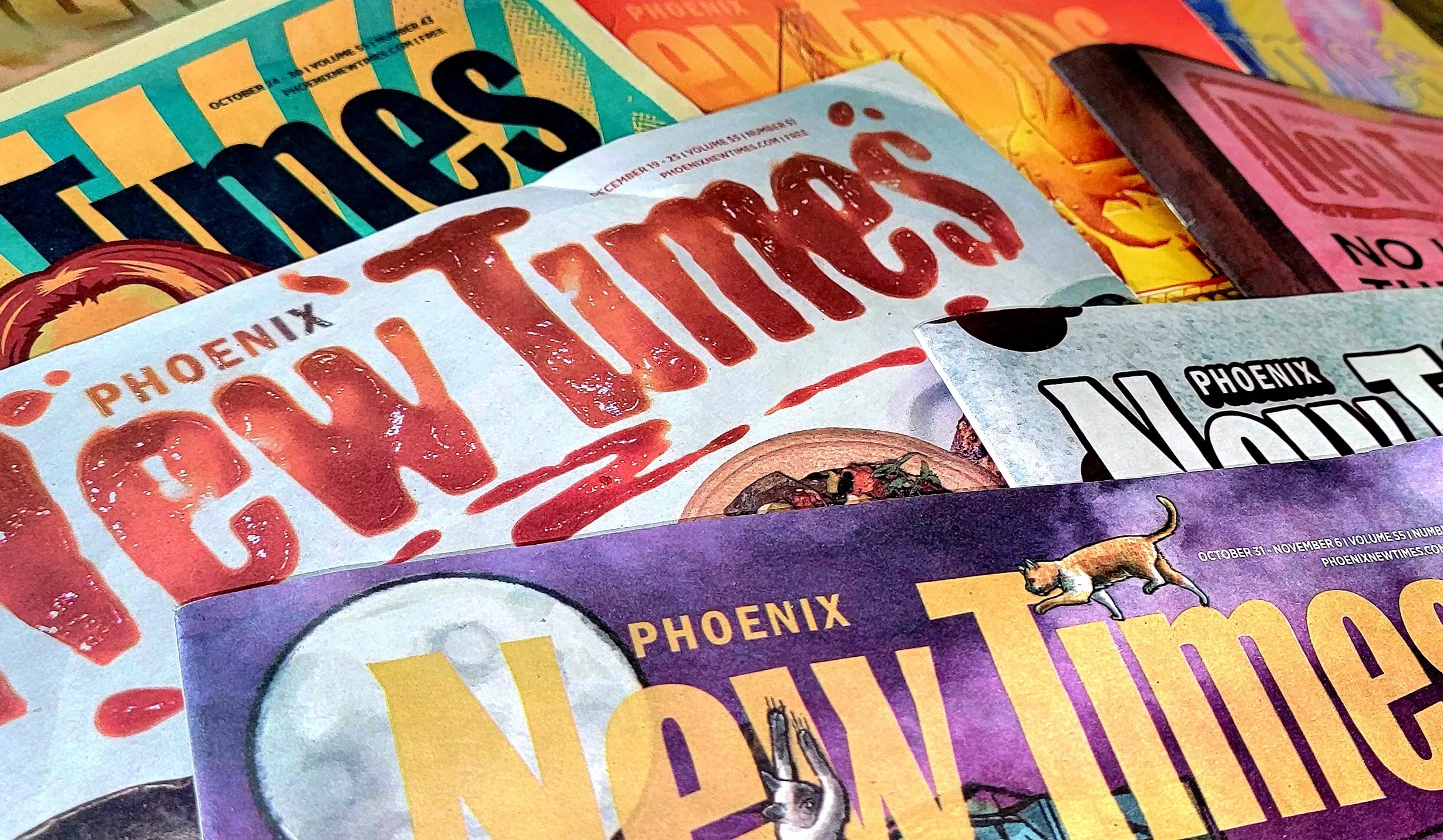 a stack of different phoenix new times issues