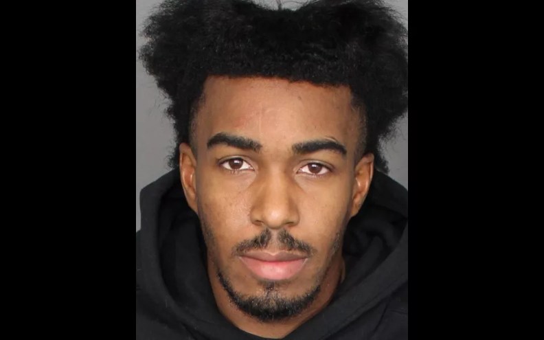 a mugshot of a young man