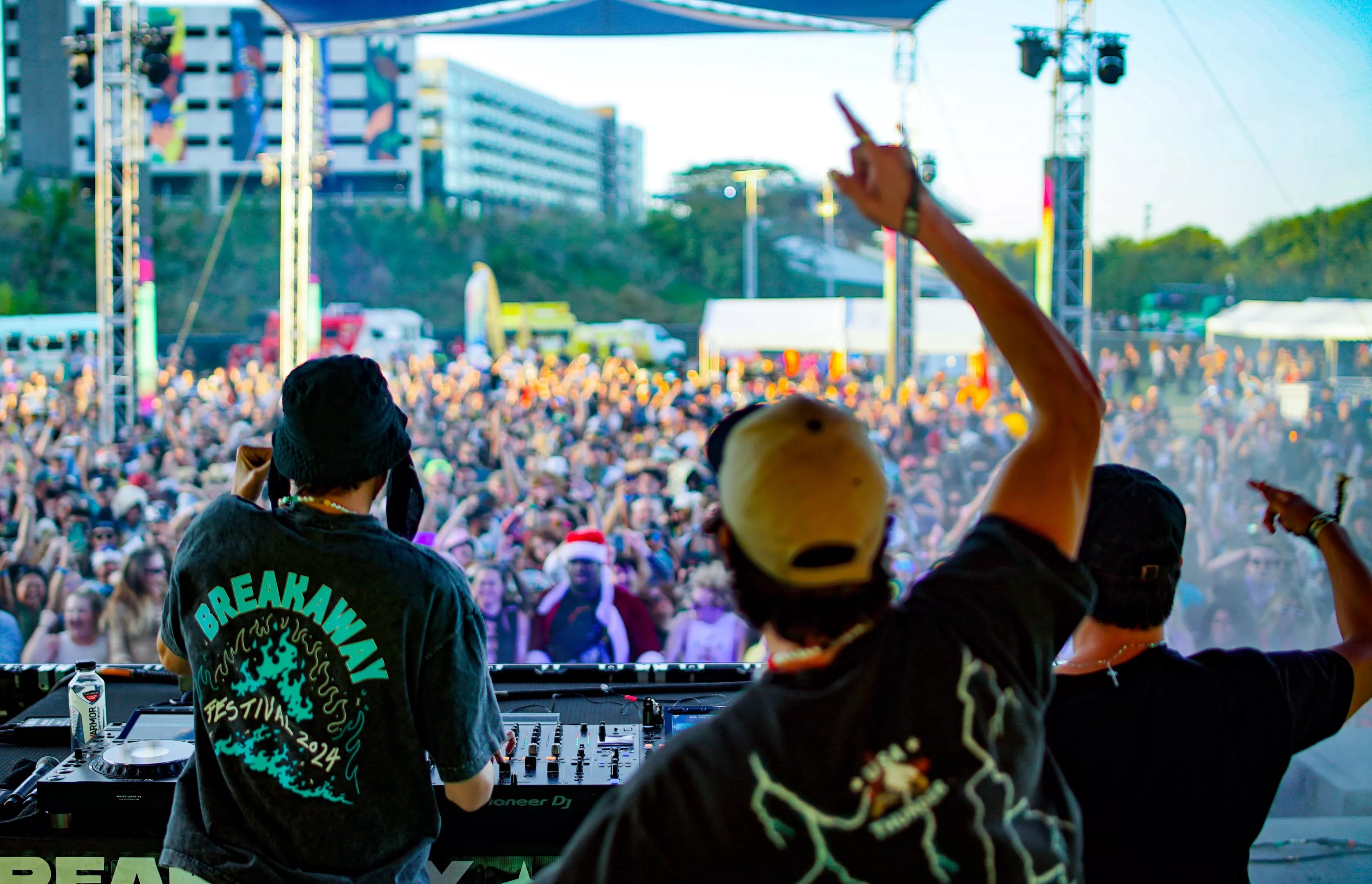 Two men perform in front of a crowd