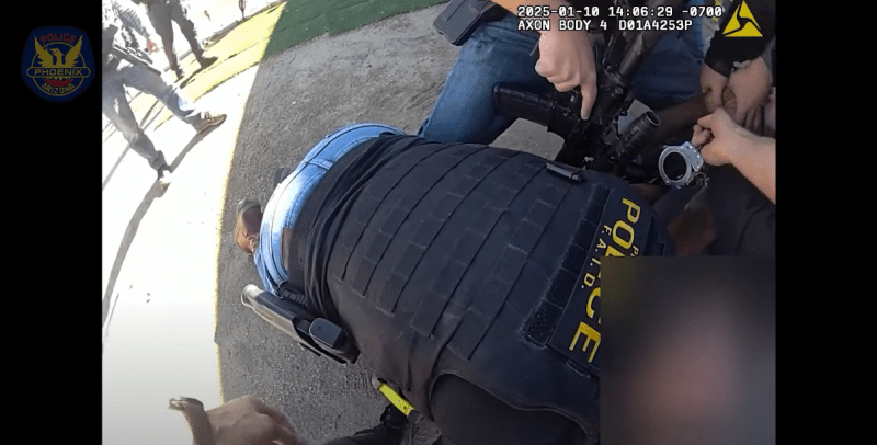 body-cam footage of a man being arrested by a host of officers