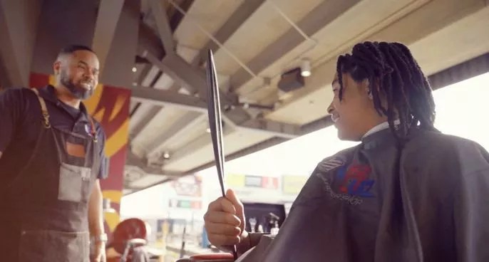 A man giving someone a haircut.