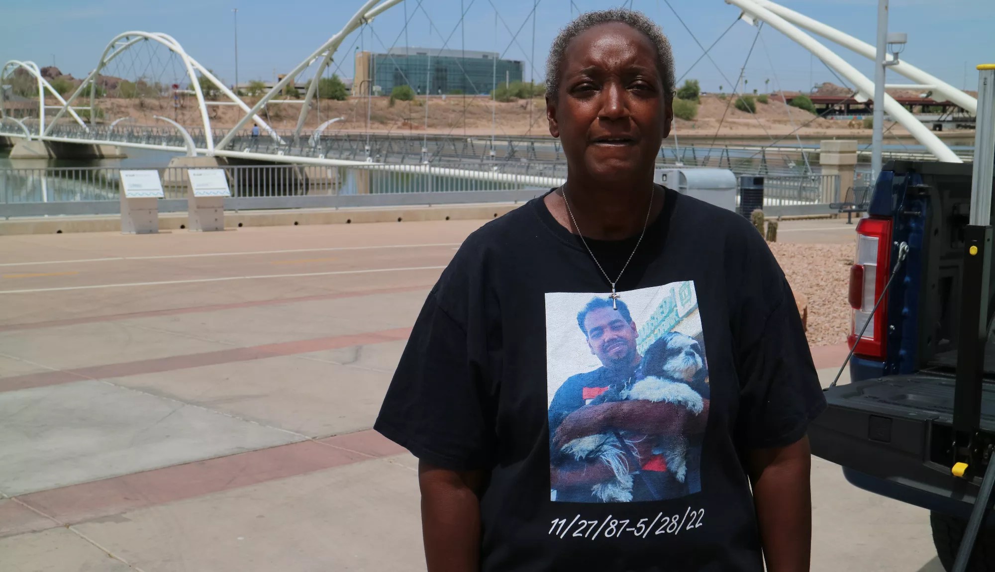a woman in a t-shirt that has a picture of her dead son