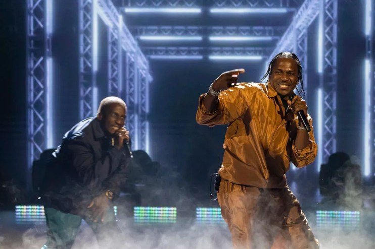 2 men perform on stage