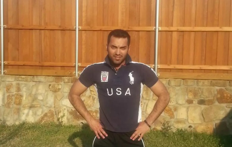 a man in a USA rugby shirt