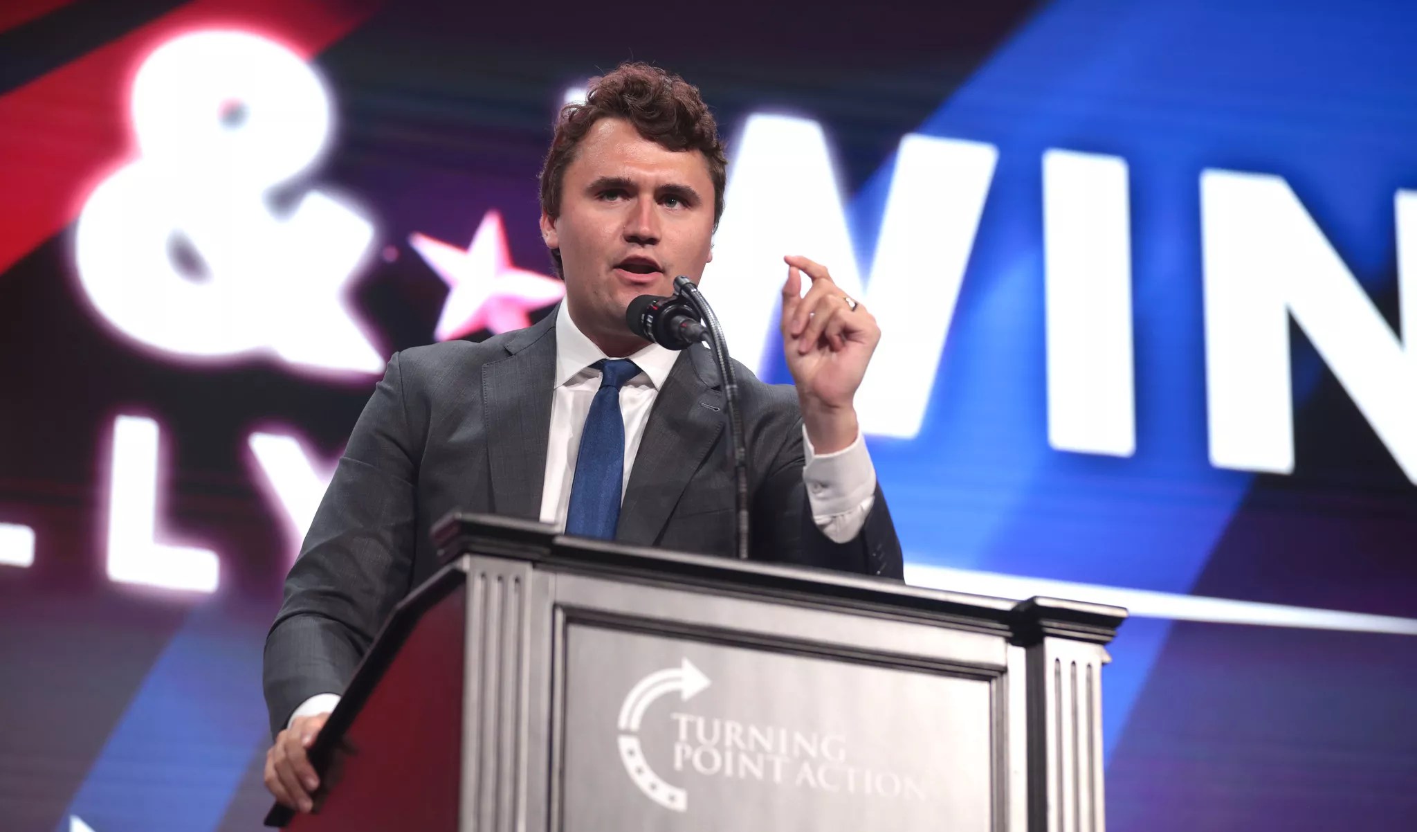 charlie kirk speaking at a podium