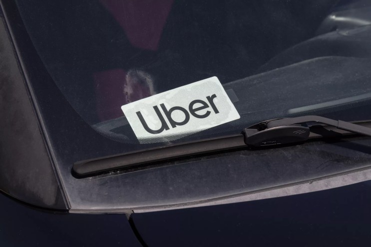 an uber logo in the windshield of a car